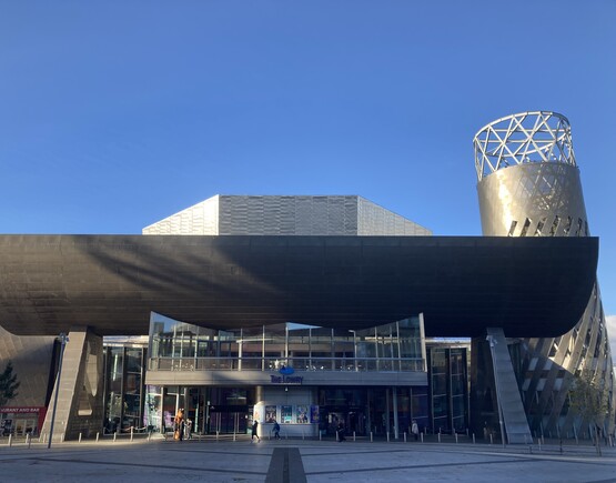 Exterior of The Lowry, a modern theatre building, on a sunny day